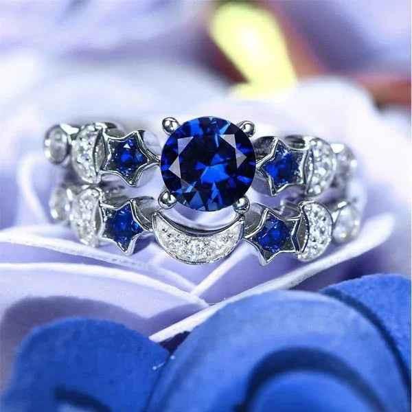 Women's blue gemstone moon ring by Stylish 3Sixty5 featuring a silver band and a prominent blue gemstone in a moon design.
