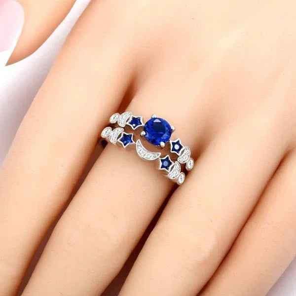 Women's blue gemstone moon ring from Stylish 3Sixty5 featuring a silver band and a prominent moon-shaped blue gemstone.