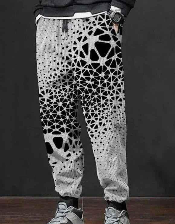 Men's printed sweatpants by Stylish 3Sixty5 with bold all-over print and tapered comfort fit, shown in a relaxed style.