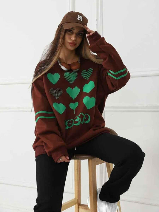Women’s brown heart-knit pullover top by Stylish 3Sixty5, featuring a cozy knit with an iconic heart design.