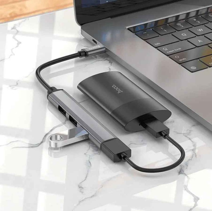 Techplus Hoco HB26 4-in-1 Type C to USB Hub showing multiple ports on a sleek black device.