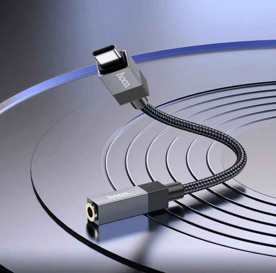 Techplus UPA32C Type C to 3.5mm audio adapter connected to a device, compact and lightweight design for versatile audio connection.