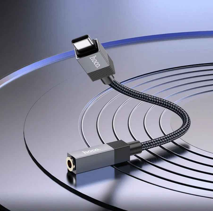 Techplus UPA32C Type C to 3.5mm audio adapter connected to a device, compact and lightweight design for versatile audio connection.