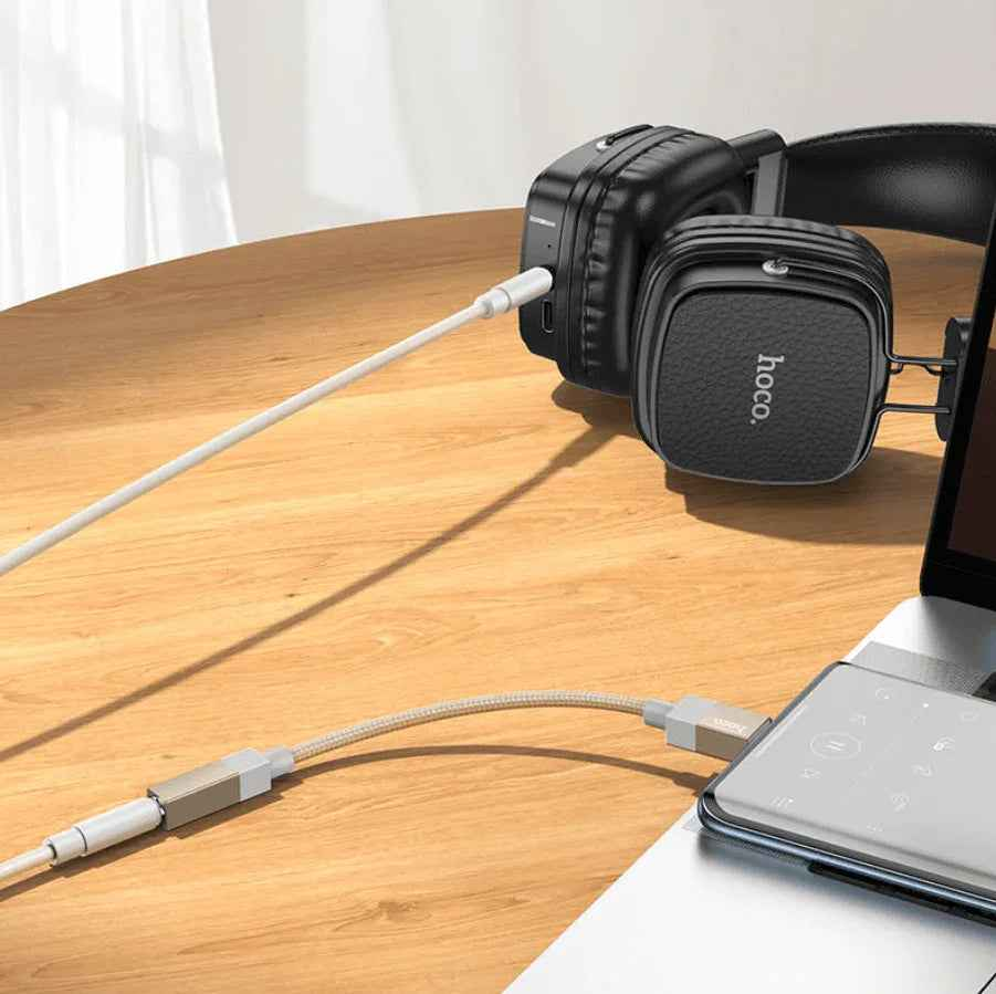 Techplus UPA32C Type C to 3.5mm audio adapter connected to a device, compact and lightweight for seamless headphone use.