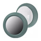 Black and green holder for Apple Air Tag, designed by That Watch Shop, shown attached to a keychain or item for tracking.