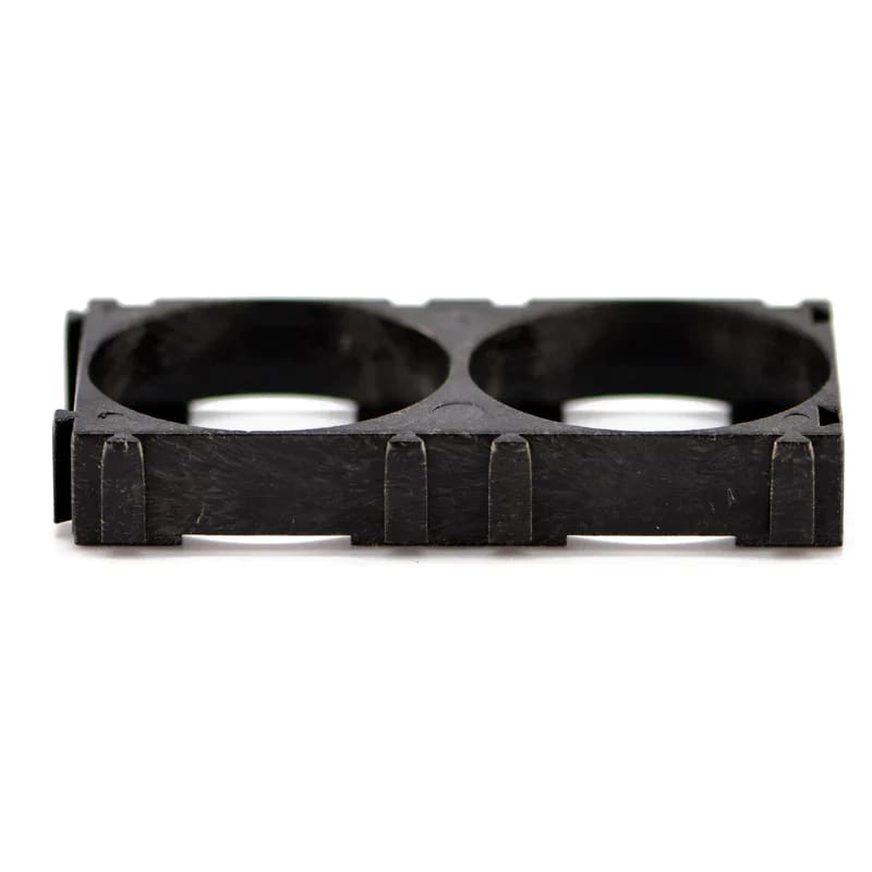 Two 26650 spacer batteries for watch power supply from That Watch Shop, shown with clear focus on the batteries and spacer.