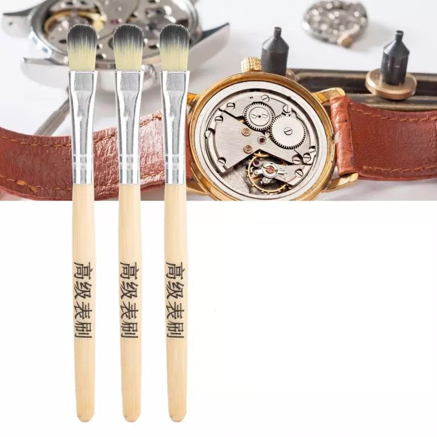 Three-piece watch cleaning brush set from That Watch Shop, featuring soft brushes for cleaning watch cases and bands.