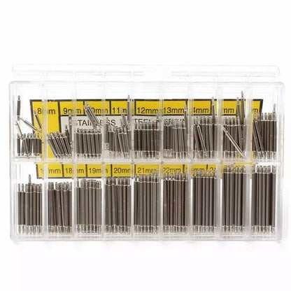 Watch strap springs for replacement, shown with watch tool accessories, designed for secure watch band attachment.