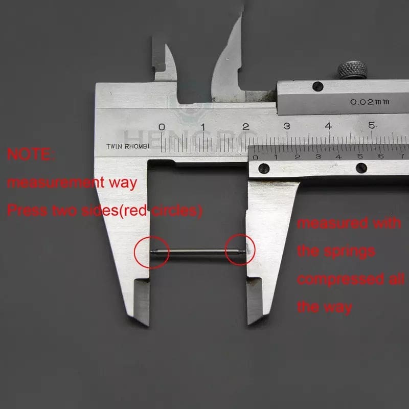 Watch strap springs for watch tools by That Watch Shop, showing small metal springs used for attaching watch straps.