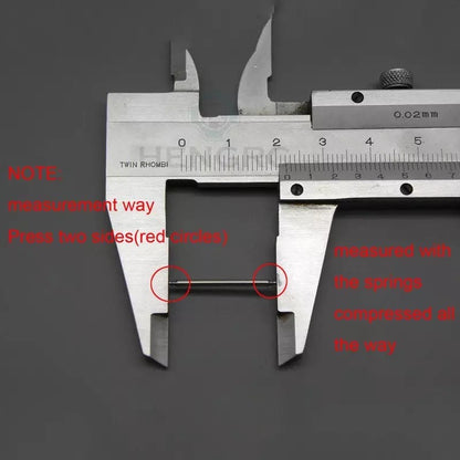 Watch strap springs for watch tools by That Watch Shop, showing small metal springs used for attaching watch straps.