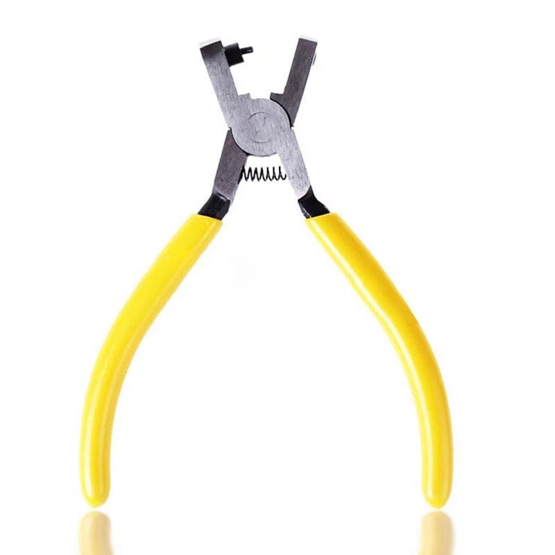 Leather hole punch tool by That Watch Shop for watch straps and belts, featuring a sturdy metal design and precise punching capacity.