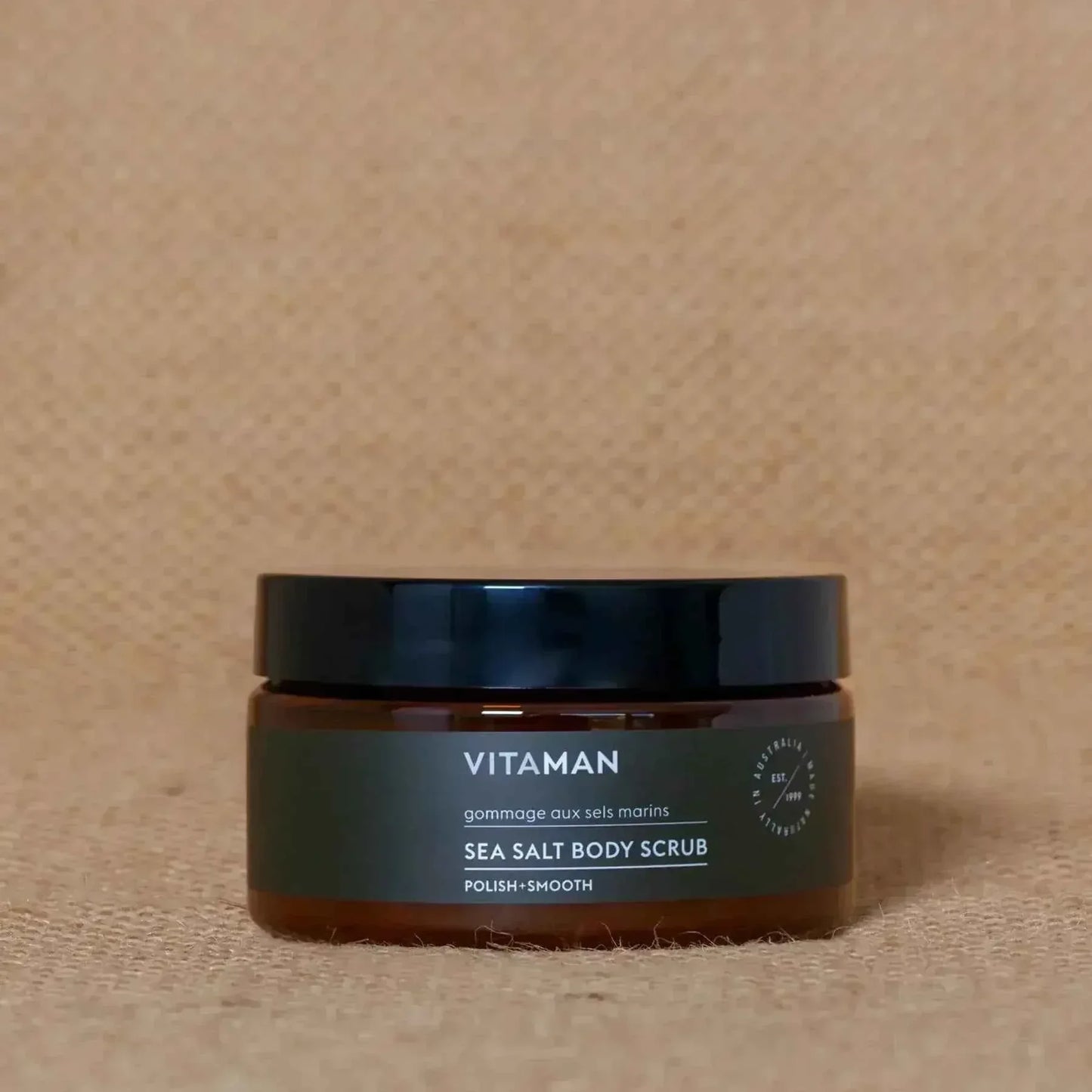 VITAMAN Australia Sea Salt Body Scrub in a jar, showing the textured salt exfoliant for smooth skin.