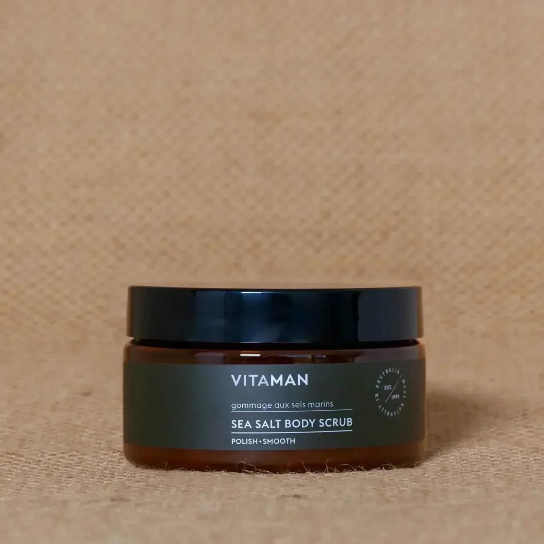 VITAMAN Australia Sea Salt Body Scrub in a jar, showing the textured salt exfoliant for smooth skin.