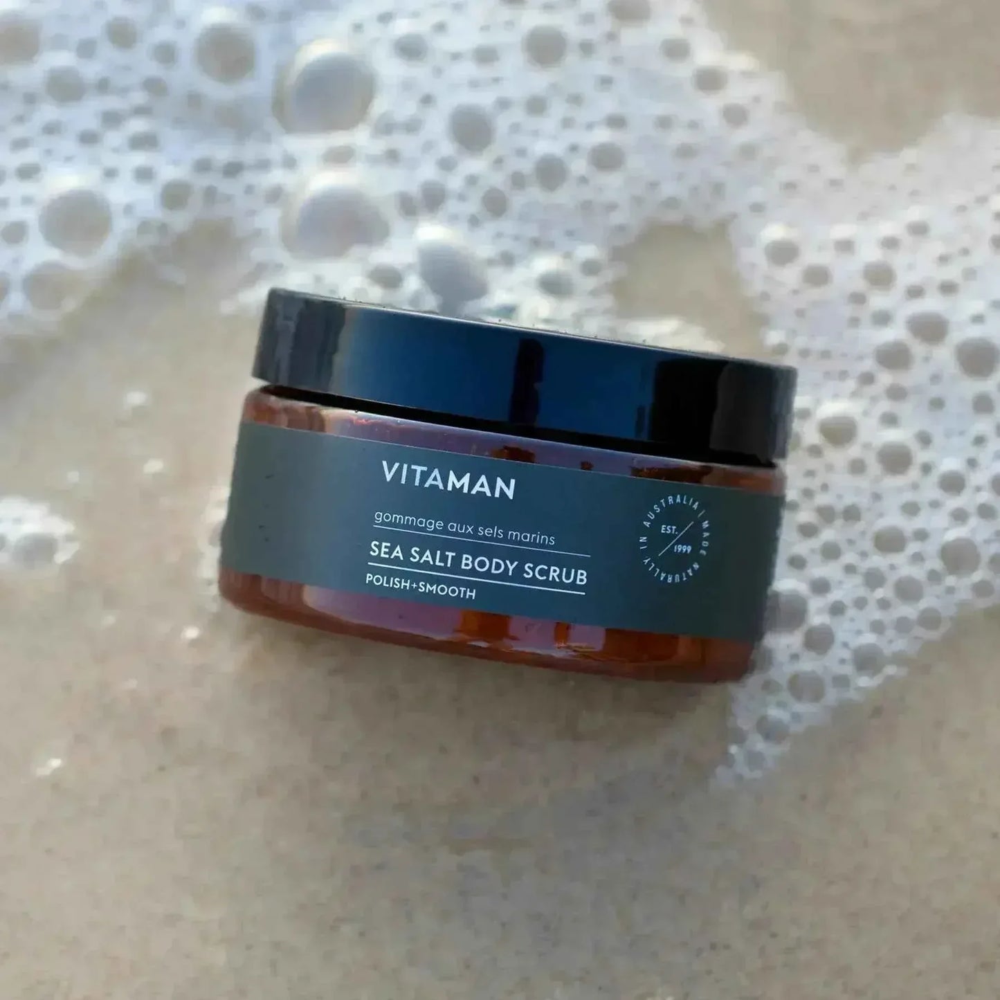 VITAMAN Australia Sea Salt Body Scrub in a jar, showing the textured salt exfoliant for smooth, refreshed skin.