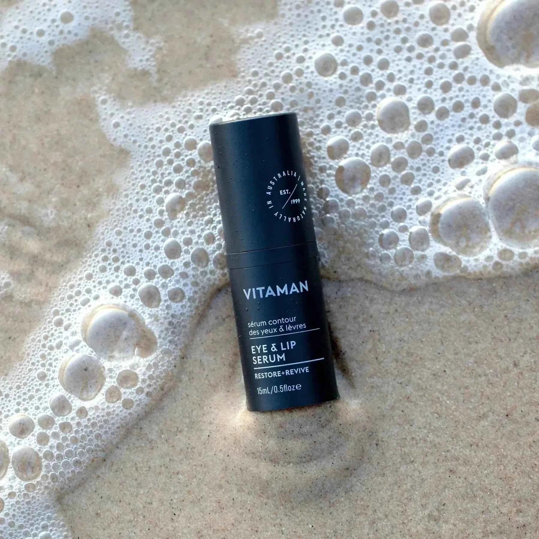 VITAMAN Australia Eye & Lip Serum for face showing the serum applicator and container, designed to reduce puffiness and fine lines.