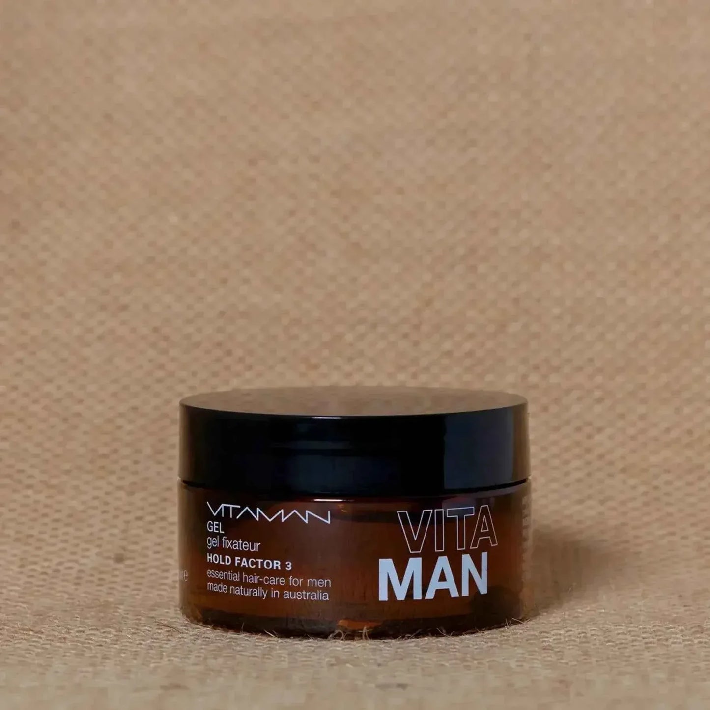 VITAMAN Australia men's medium hold hair gel in 100g container, ideal for styling and essential skin care.