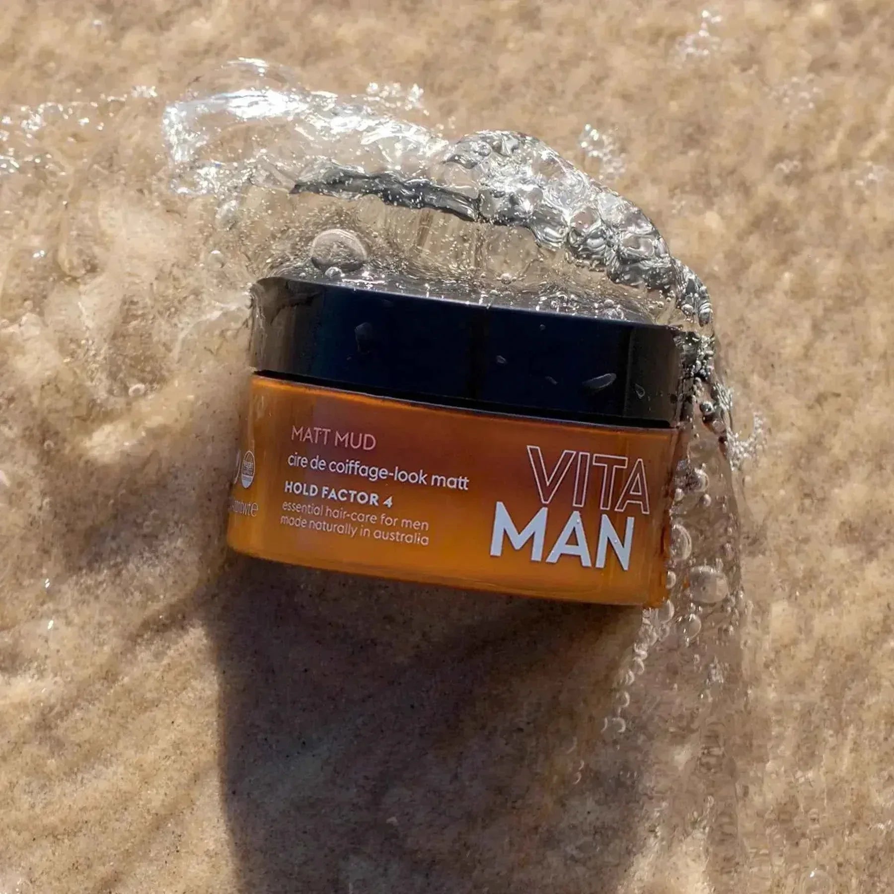 VITAMAN Australia Matt Mud Max Hold 100g hair styling clay with strong hold, showcasing the product container and textured clay.