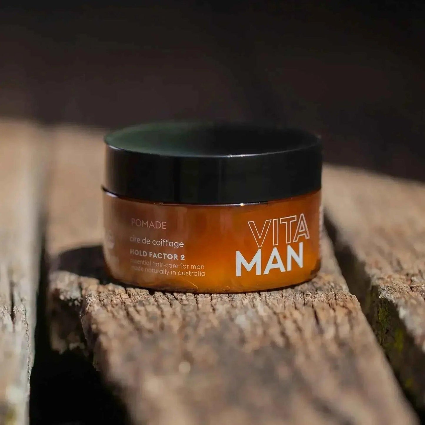 VITAMAN Australia hair pomade in 100g jar, showcasing the product's packaging and texture for styling hair.
